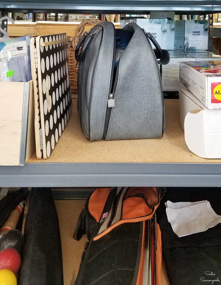 bowling ball and bag at a thrift store