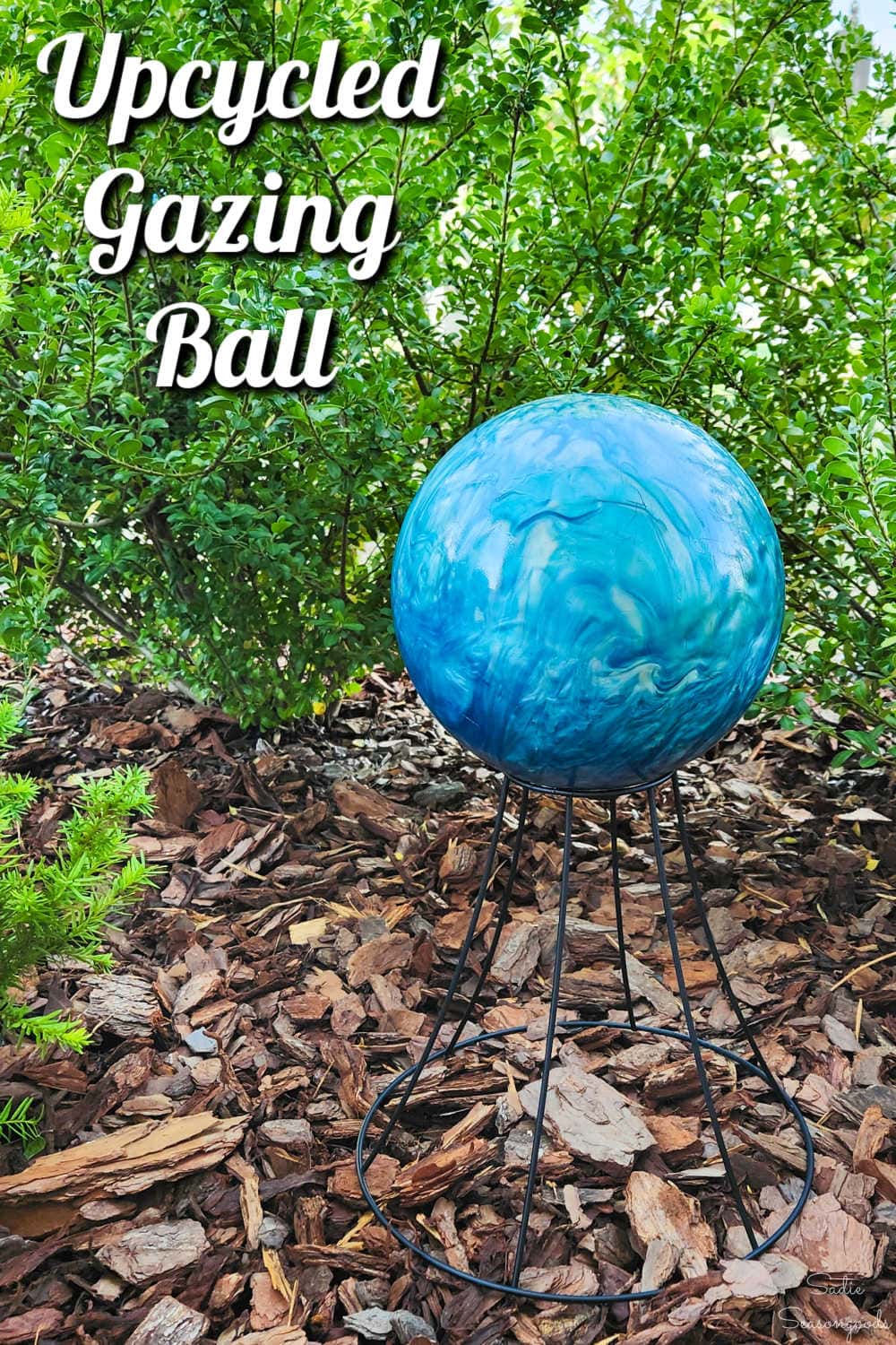 bowling ball turned into a gazing ball for the garden