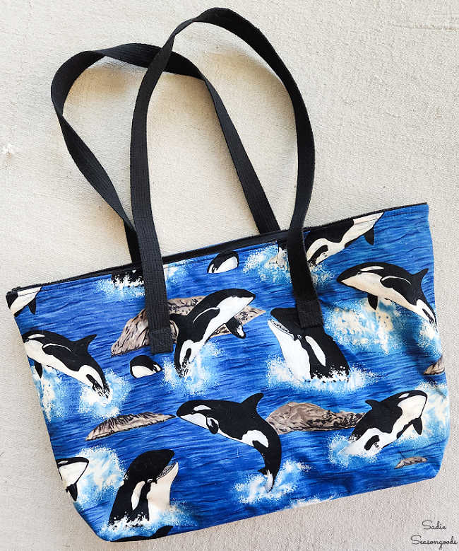 retro tote bag with orcas on it