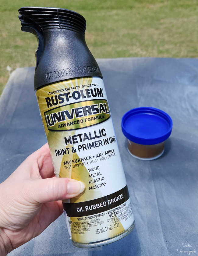 painting a plastic lid from the recycling bin