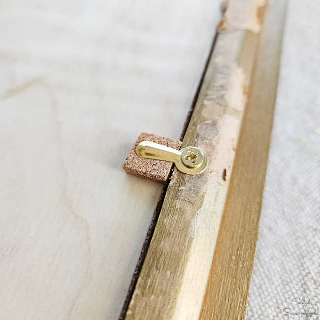 securing the wall decor with turn buttons